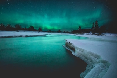 Northern lights over a snowy Manitoba lake