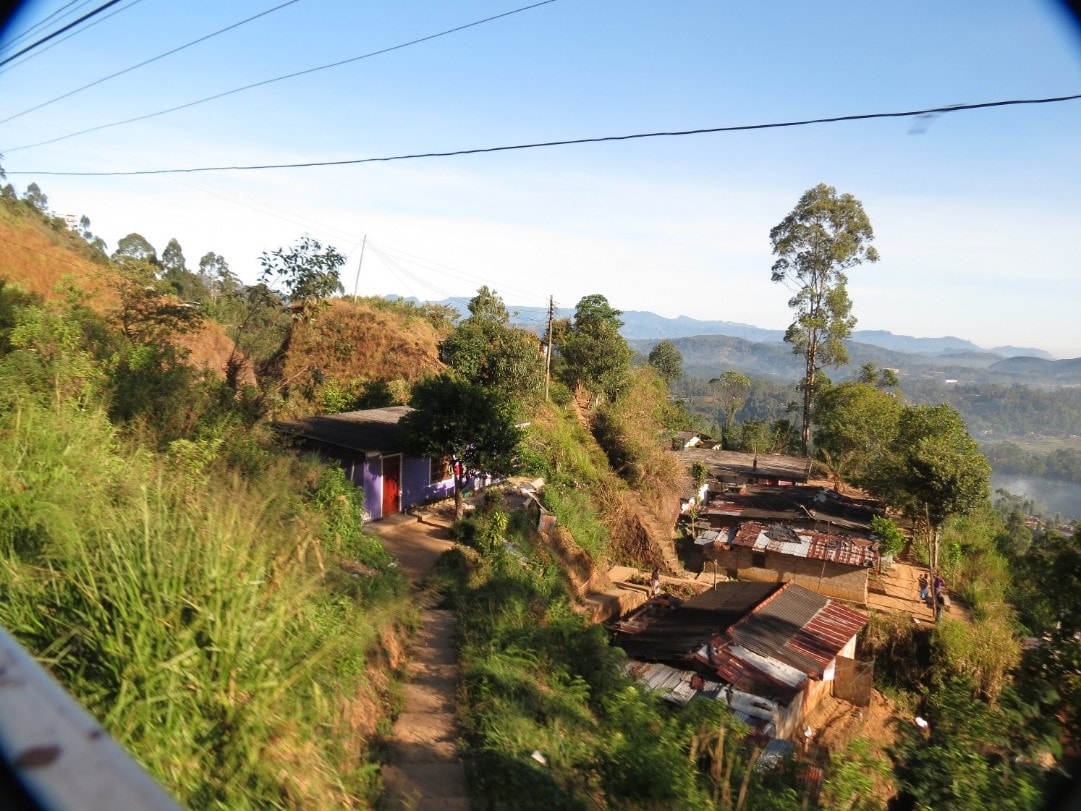 Among lots of farmland and tea plantations lies a little village on a hill made out of corrugated iron