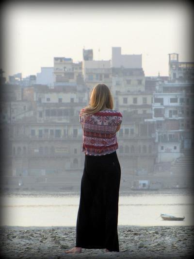 Woman overlooking Indian cityscape