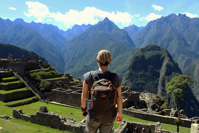 Woman overlooking Machu Picchu