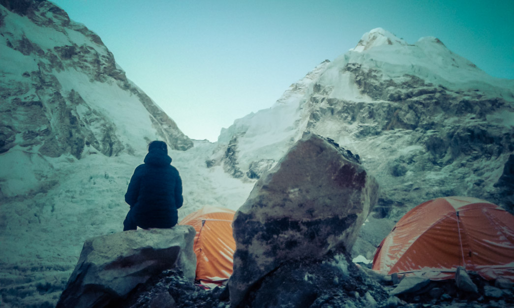 Woman sitting at Everest basecamp