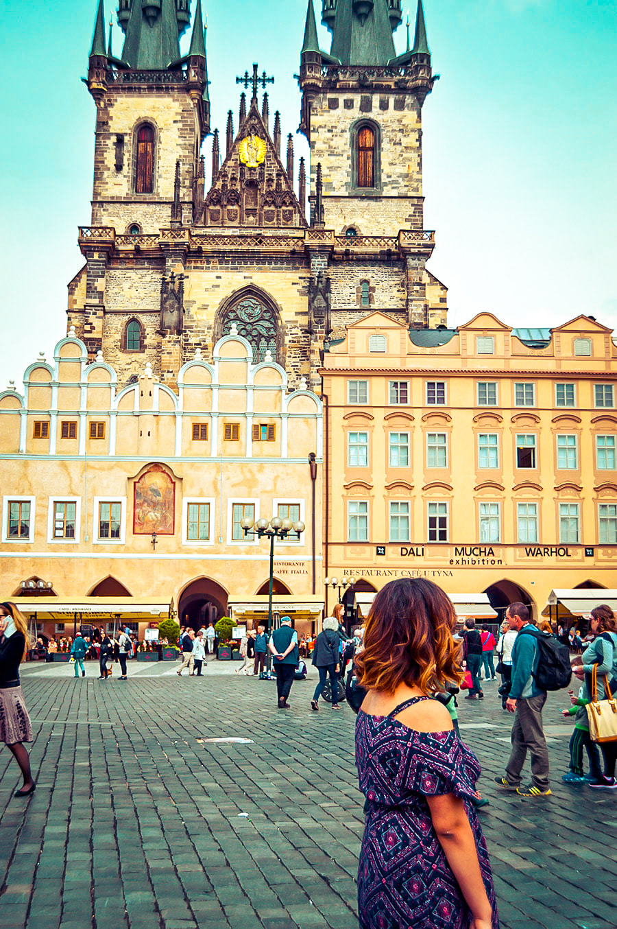 A woman enjoys the atmosphere and European architecture