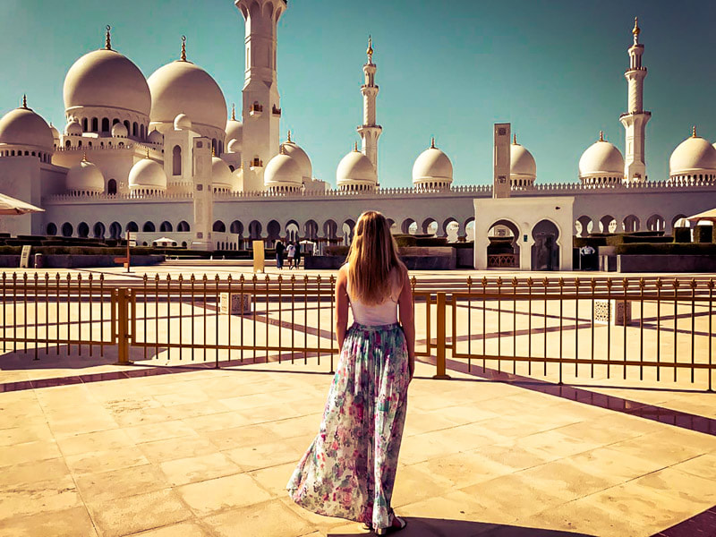 Picture of a woman looking the the Sheikh Zayed Mosque in Abu Dhabi