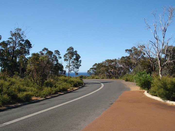 Australian road with ocean just around the bend